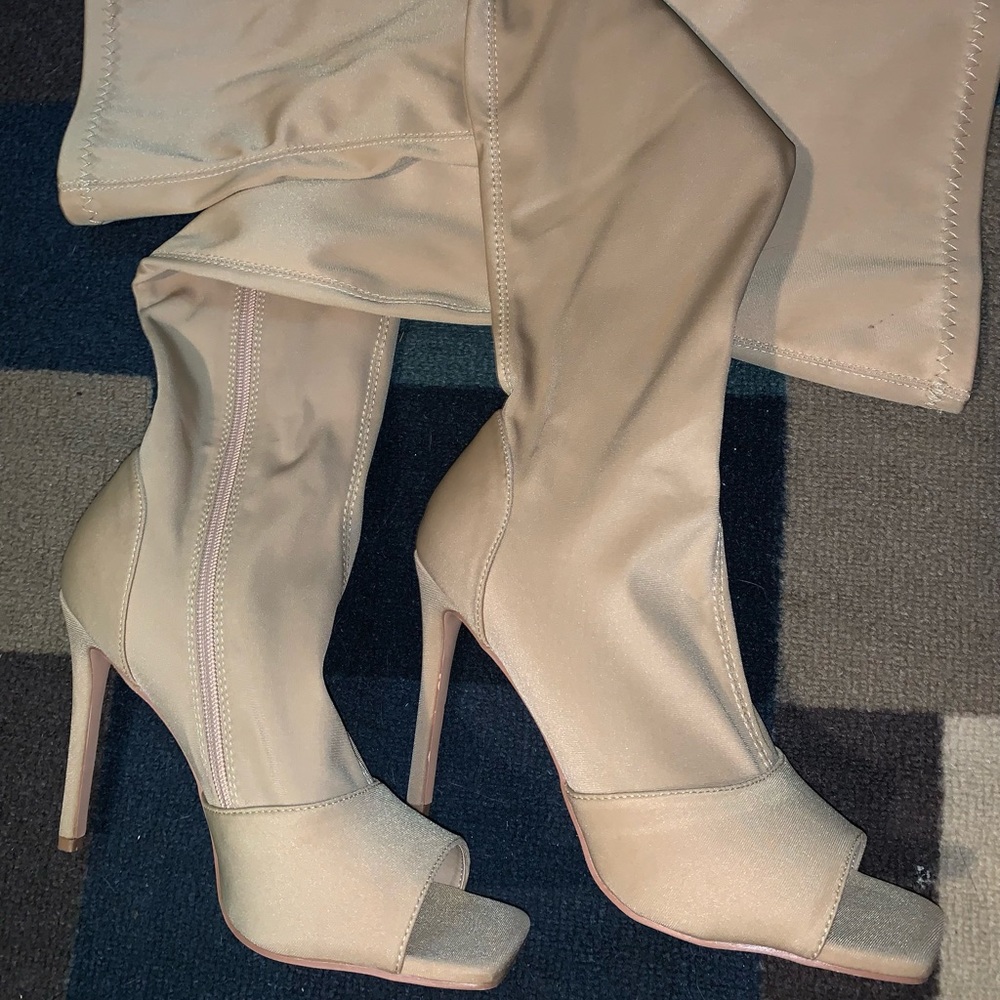 Tan, thigh high, open toe boots—unworn.